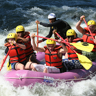 group of rafters in a boat Multisport Tours Slovenia
